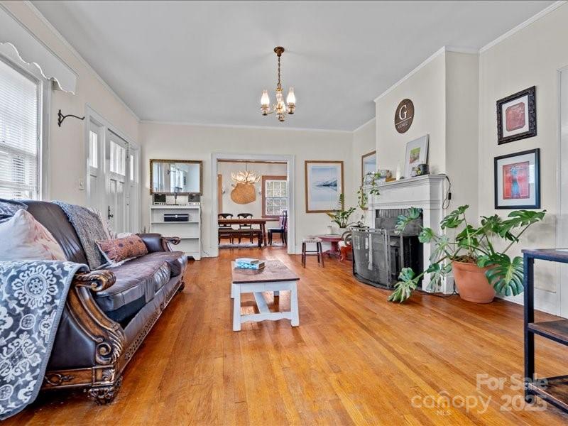 430 3rd Street Cheraw, SC 29520 - Photo 9 of 40 a living room with furniture fireplace and wooden floor