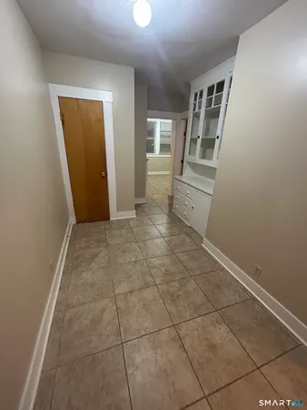 a view of a kitchen from the hallway