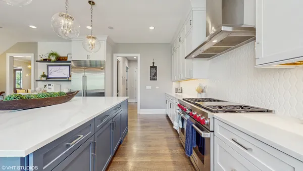 a kitchen with stainless steel appliances granite countertop a stove and a sink