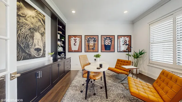 a dining room with furniture and a potted plant