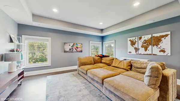 a living room with furniture and a rug