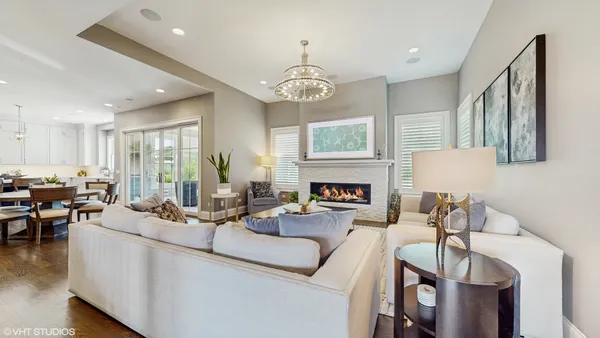 a living room with furniture fireplace and window