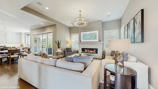 a living room with furniture fireplace and window