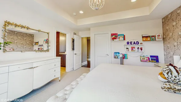 a bed room with a bed and a dresser