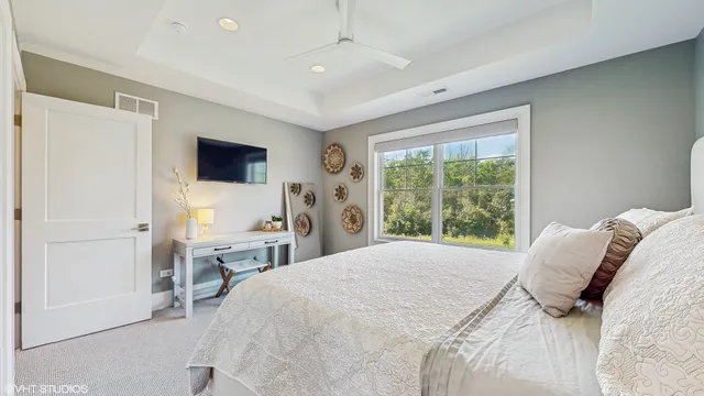 a bathroom with a sink a toilet and a large mirror