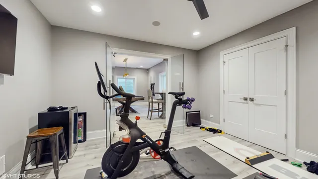 a living room with furniture a flat screen tv and a table
