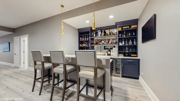 a view of a patio with couches table and chairs and potted plants