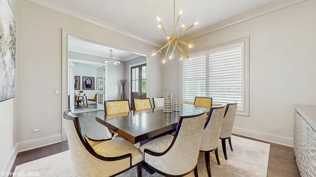 a dining room with furniture and window