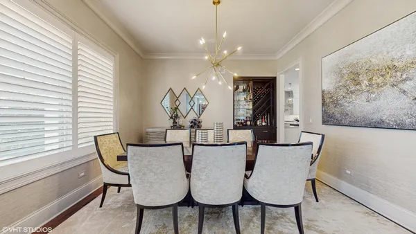 a view of a dining room with furniture and window