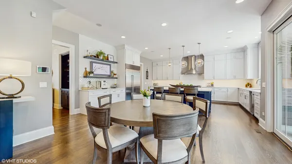 a view of a dining room with furniture and wooden floor