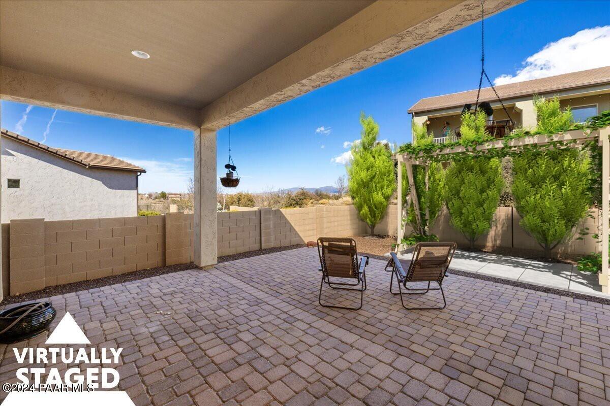 1478 Range View Circle Prescott Valley, AZ 86314 - Photo 17 of 31 a view of a chairs and table in the patio