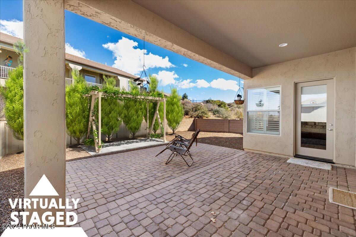 1478 Range View Circle Prescott Valley, AZ 86314 - Photo 19 of 31 a living room view with a floor to ceiling window and potted plants