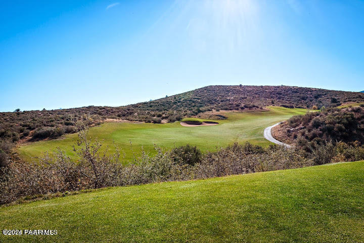 1478 Range View Circle Prescott Valley, AZ 86314 - Photo 25 of 31 a view of a lake with a mountain in the background