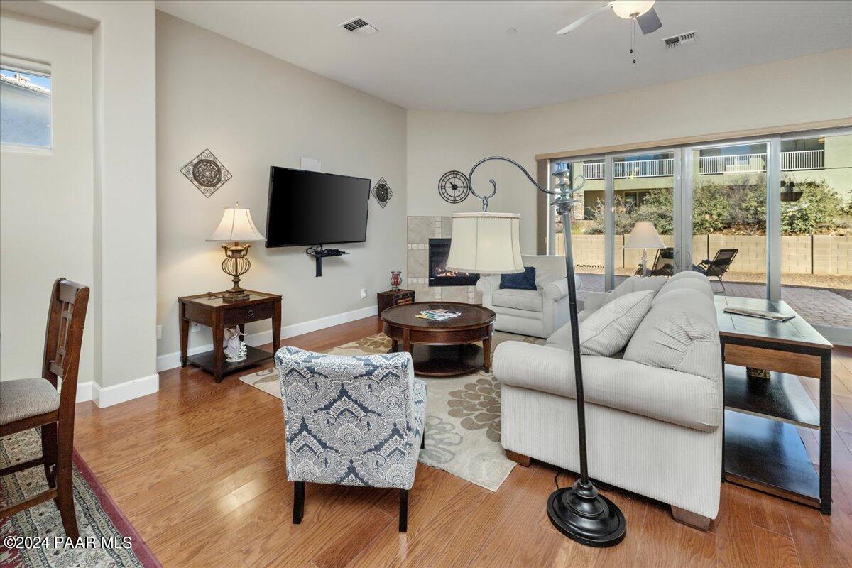 1478 Range View Circle Prescott Valley, AZ 86314 - Photo 3 of 31 a living room with furniture and a flat screen tv