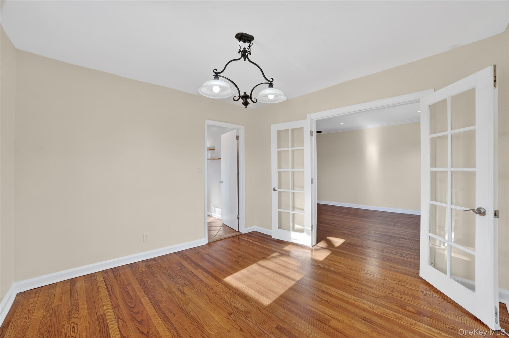 2 S Road, Unit 2P Harrison, NY 10528 - Photo 12 of 35 a view of empty room with wooden floor