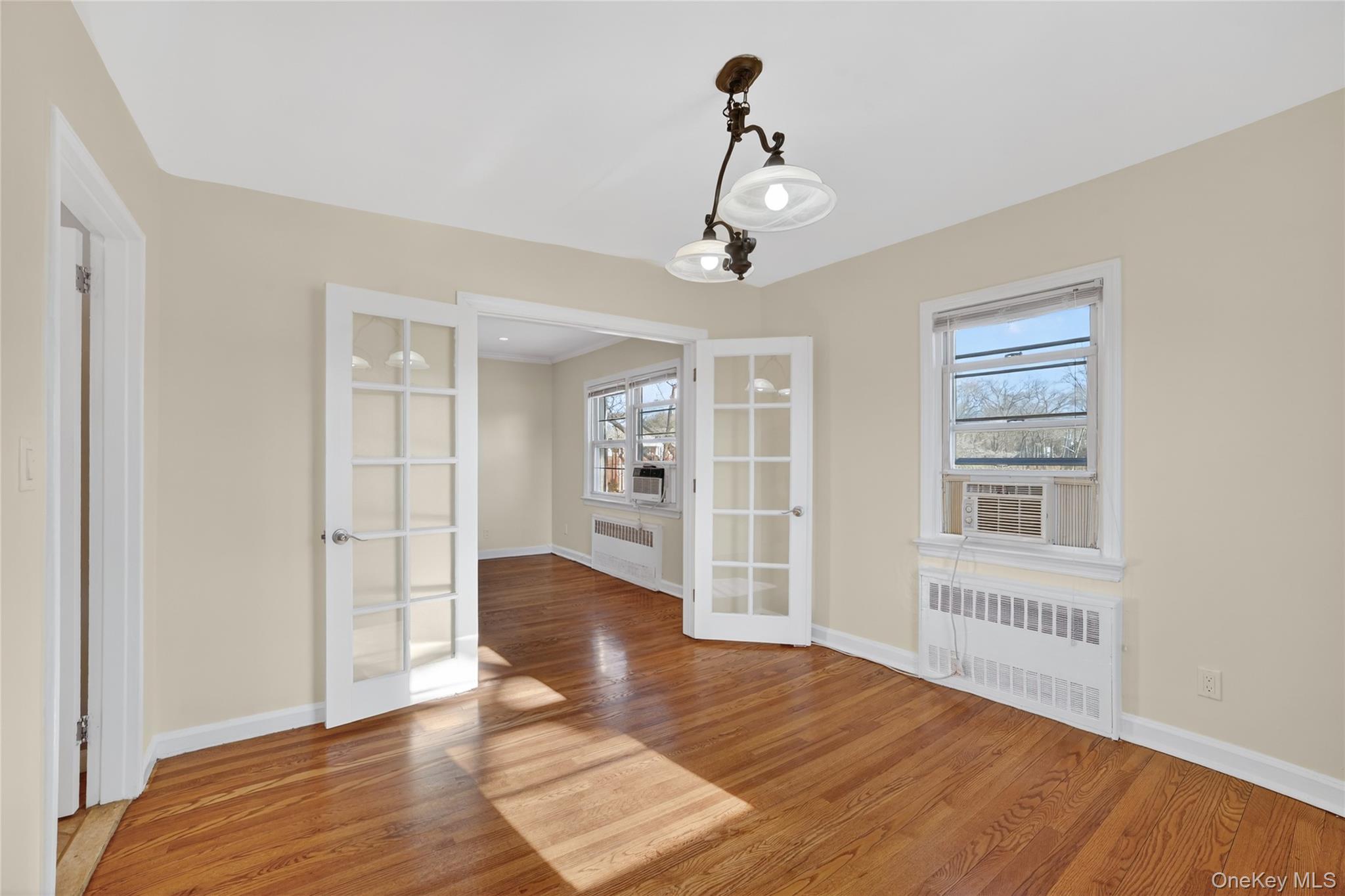 2 S Road, Unit 2P Harrison, NY 10528 - Photo 13 of 35 a view of livingroom with hardwood floor and window