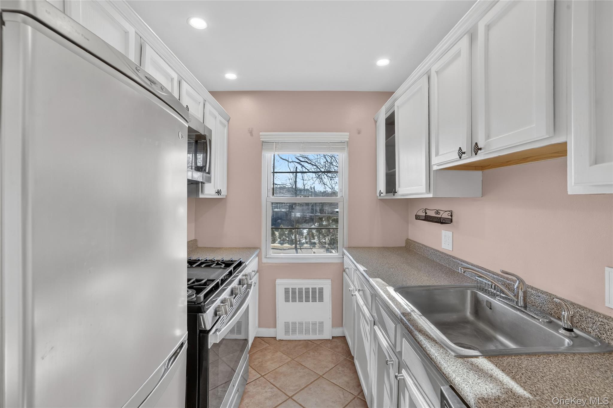 2 S Road, Unit 2P Harrison, NY 10528 - Photo 15 of 35 a kitchen with a sink stove and refrigerator