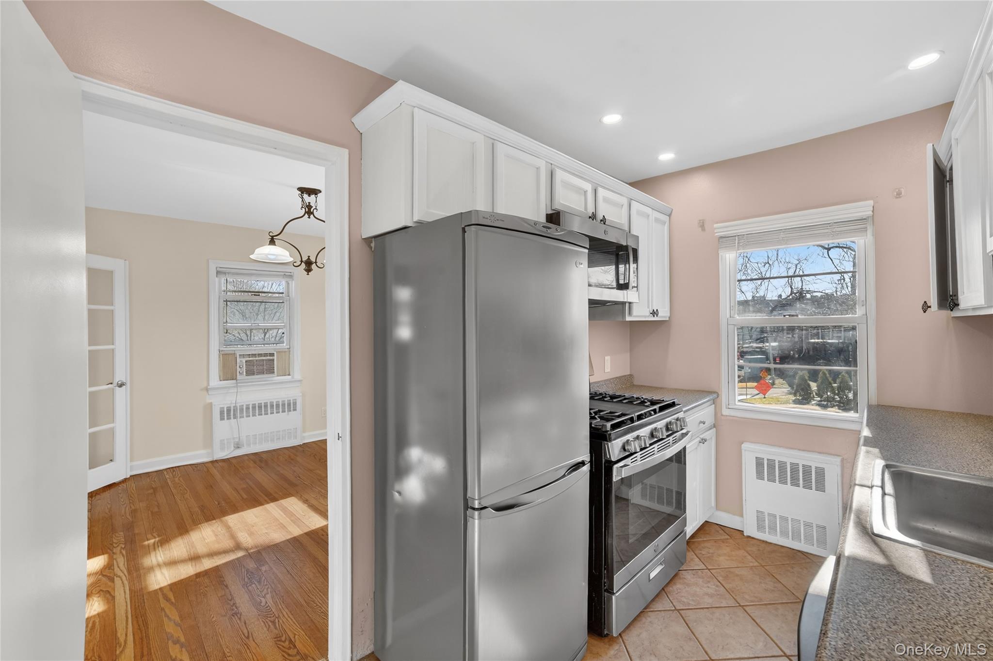 2 S Road, Unit 2P Harrison, NY 10528 - Photo 16 of 35 a kitchen with stainless steel appliances a refrigerator and a stove top oven
