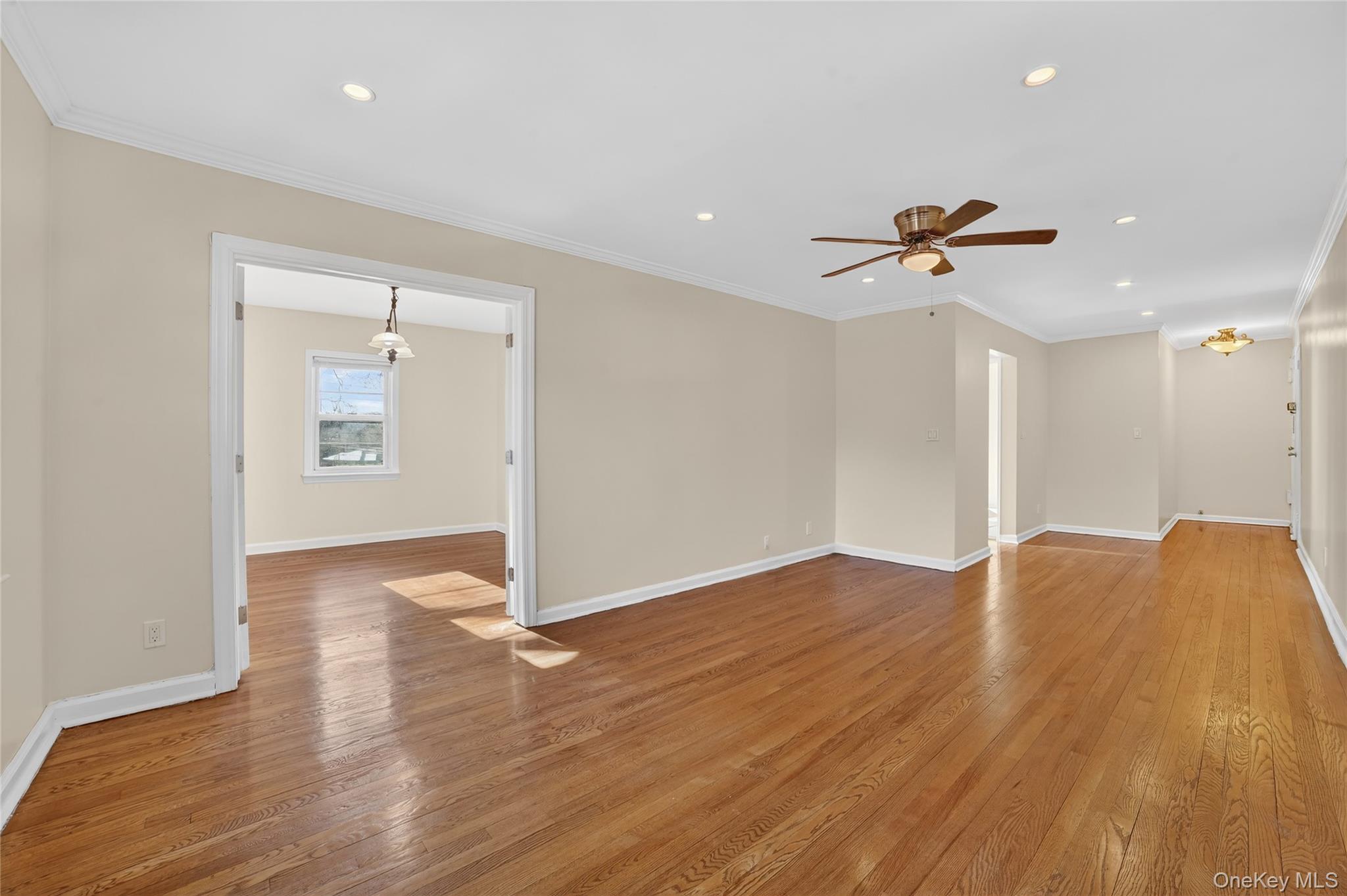 2 S Road, Unit 2P Harrison, NY 10528 - Photo 10 of 35 a view of empty room with wooden floor and fan