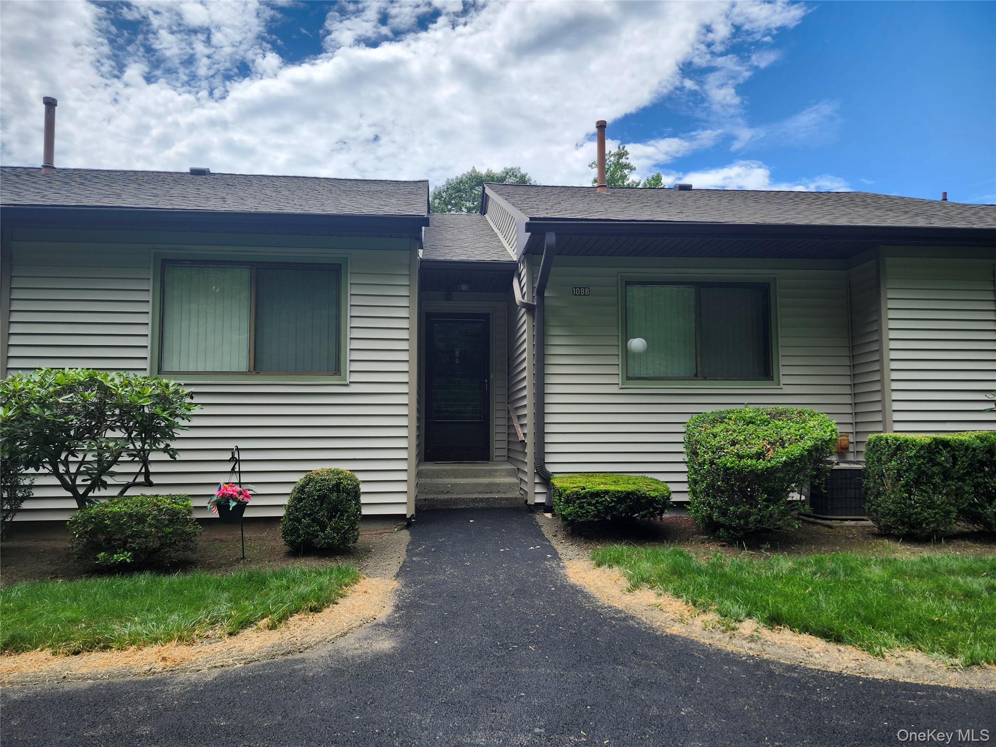 108 Village Road, Unit B Yorktown Heights, NY 10598 - Photo 1 of 42 View of front of property featuring entry steps and roof with shingles