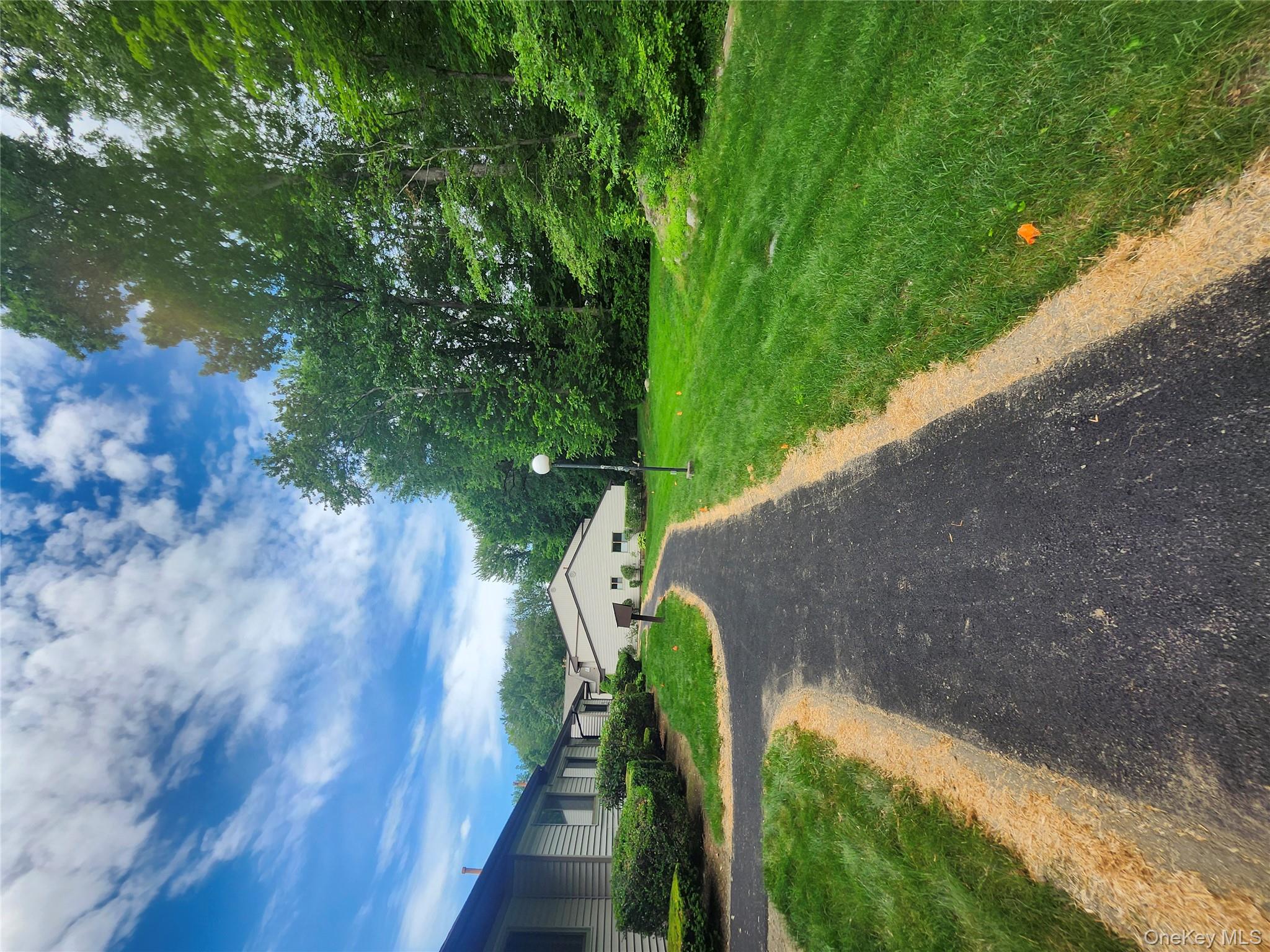 108 Village Road, Unit B Yorktown Heights, NY 10598 - Photo 13 of 42 View of asphalt road with street lighting