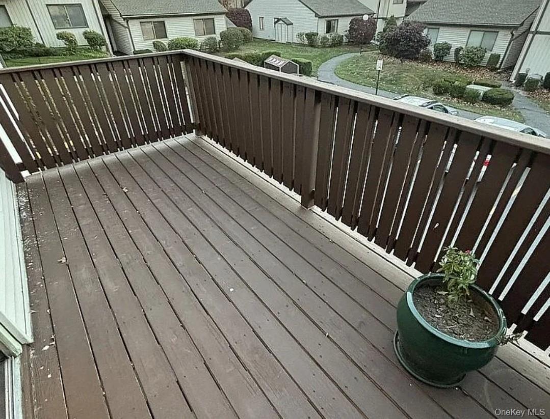 108 Village Road, Unit B Yorktown Heights, NY 10598 - Photo 16 of 42 a balcony with wooden floor