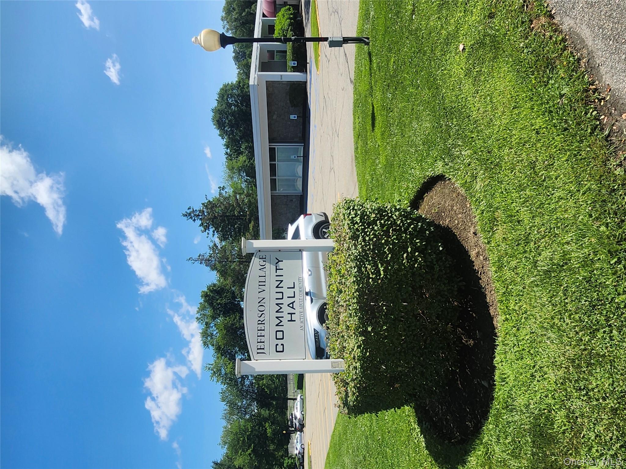 108 Village Road, Unit B Yorktown Heights, NY 10598 - Photo 20 of 42 a view of a park that has a sign board