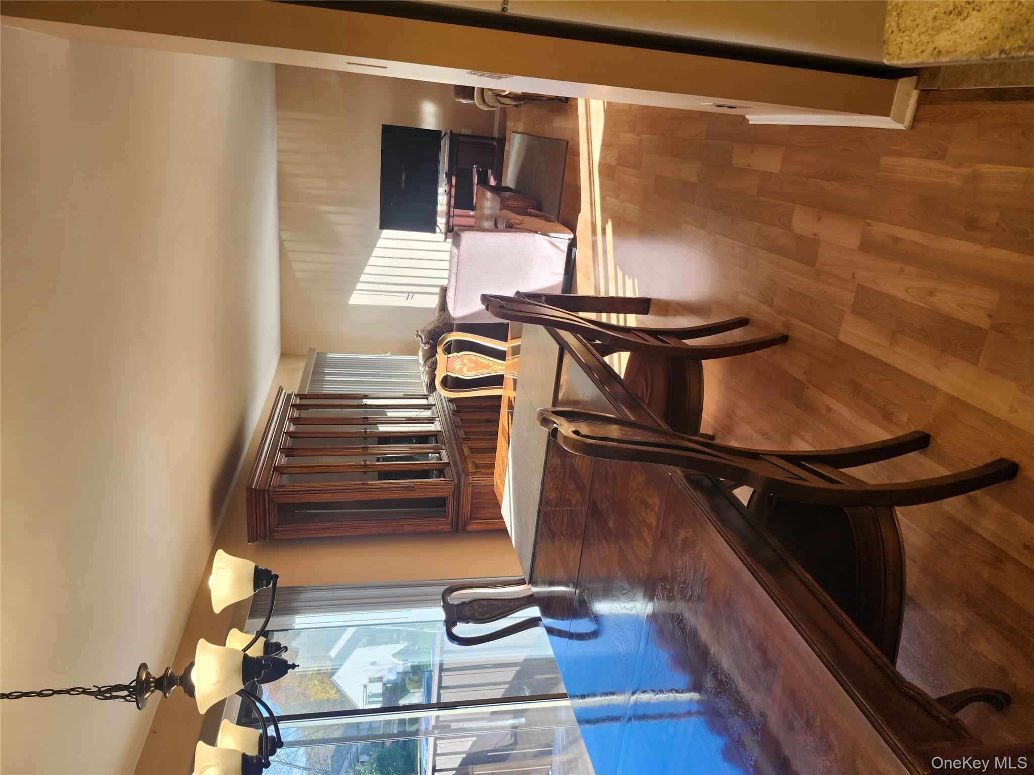 108 Village Road, Unit B Yorktown Heights, NY 10598 - Photo 24 of 42 a dining room with furniture and window