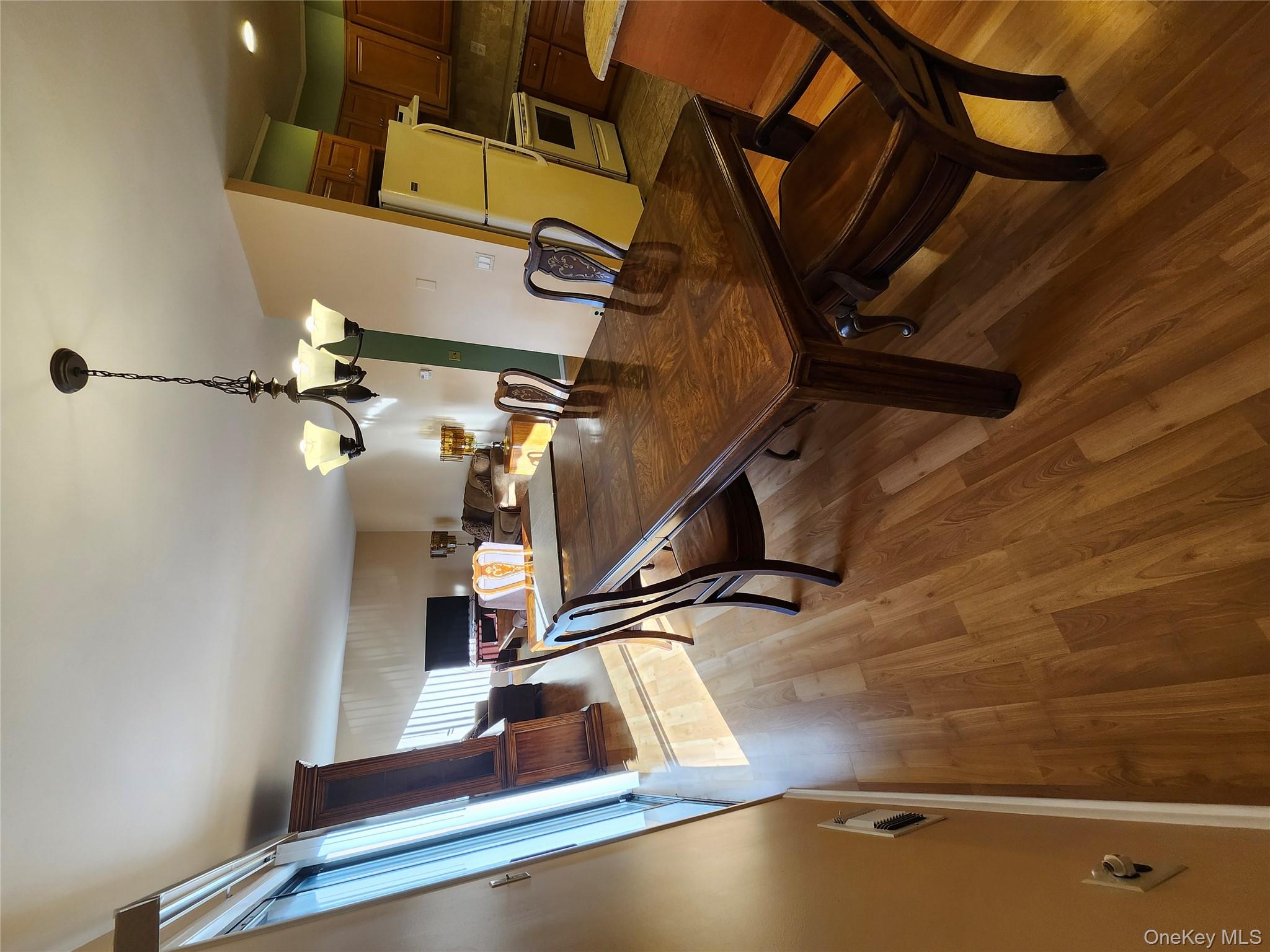 108 Village Road, Unit B Yorktown Heights, NY 10598 - Photo 26 of 42 a view of a dining room with furniture and wooden floor