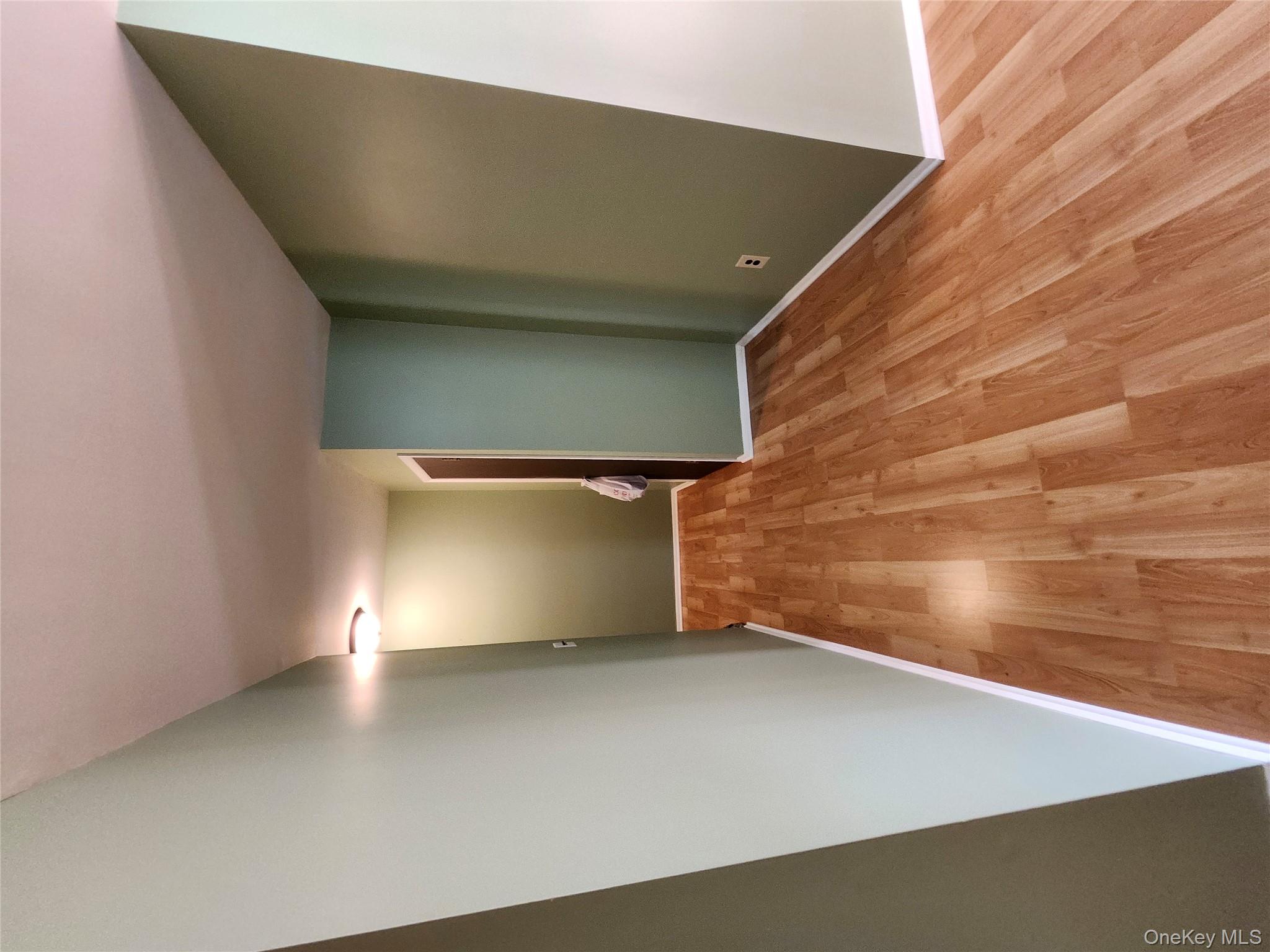 108 Village Road, Unit B Yorktown Heights, NY 10598 - Photo 31 of 42 Unfurnished room featuring light wood finished floors and baseboards