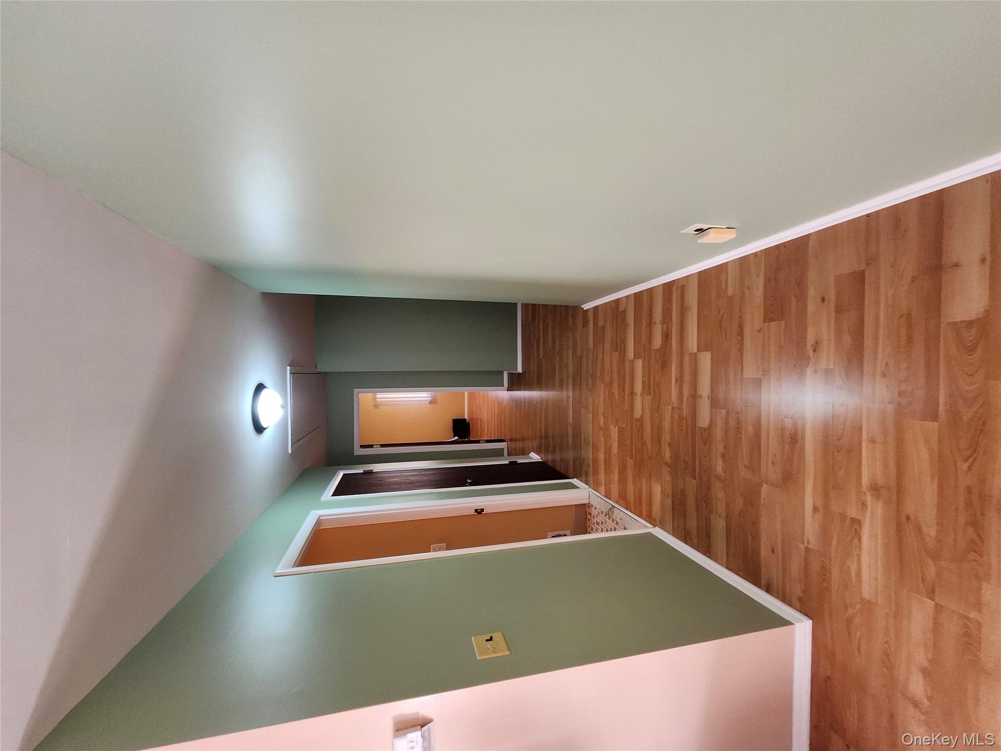 108 Village Road, Unit B Yorktown Heights, NY 10598 - Photo 33 of 42 a view of a hallway with wooden floor