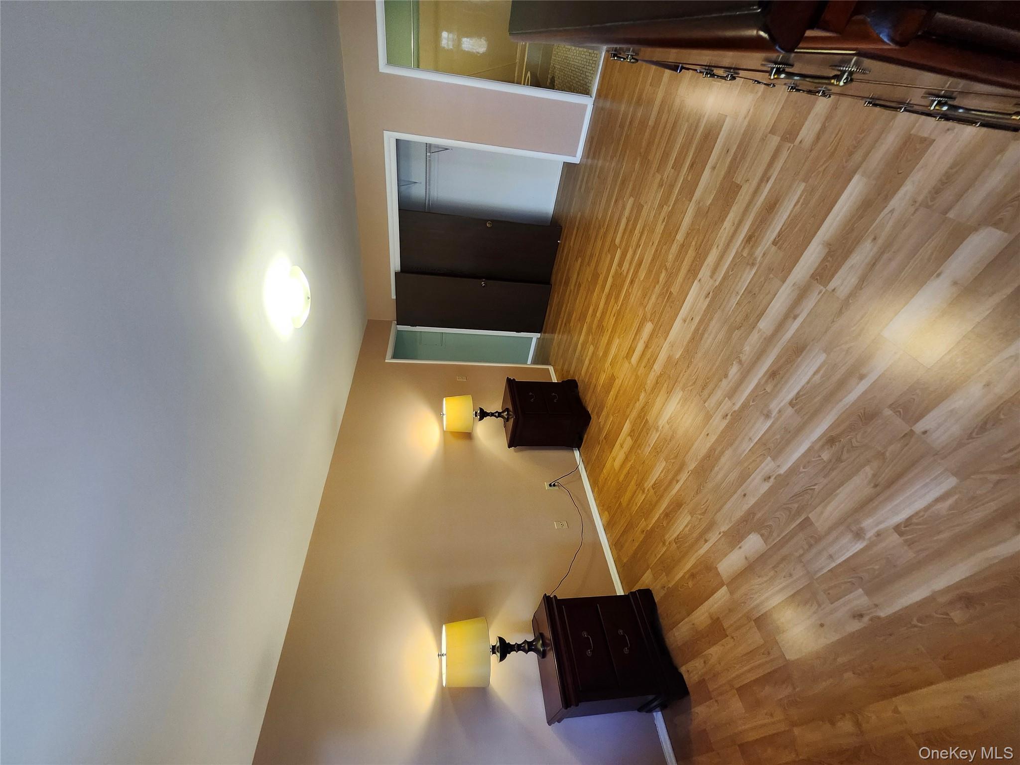 108 Village Road, Unit B Yorktown Heights, NY 10598 - Photo 35 of 42 a bedroom with a bed and a lamp on desk