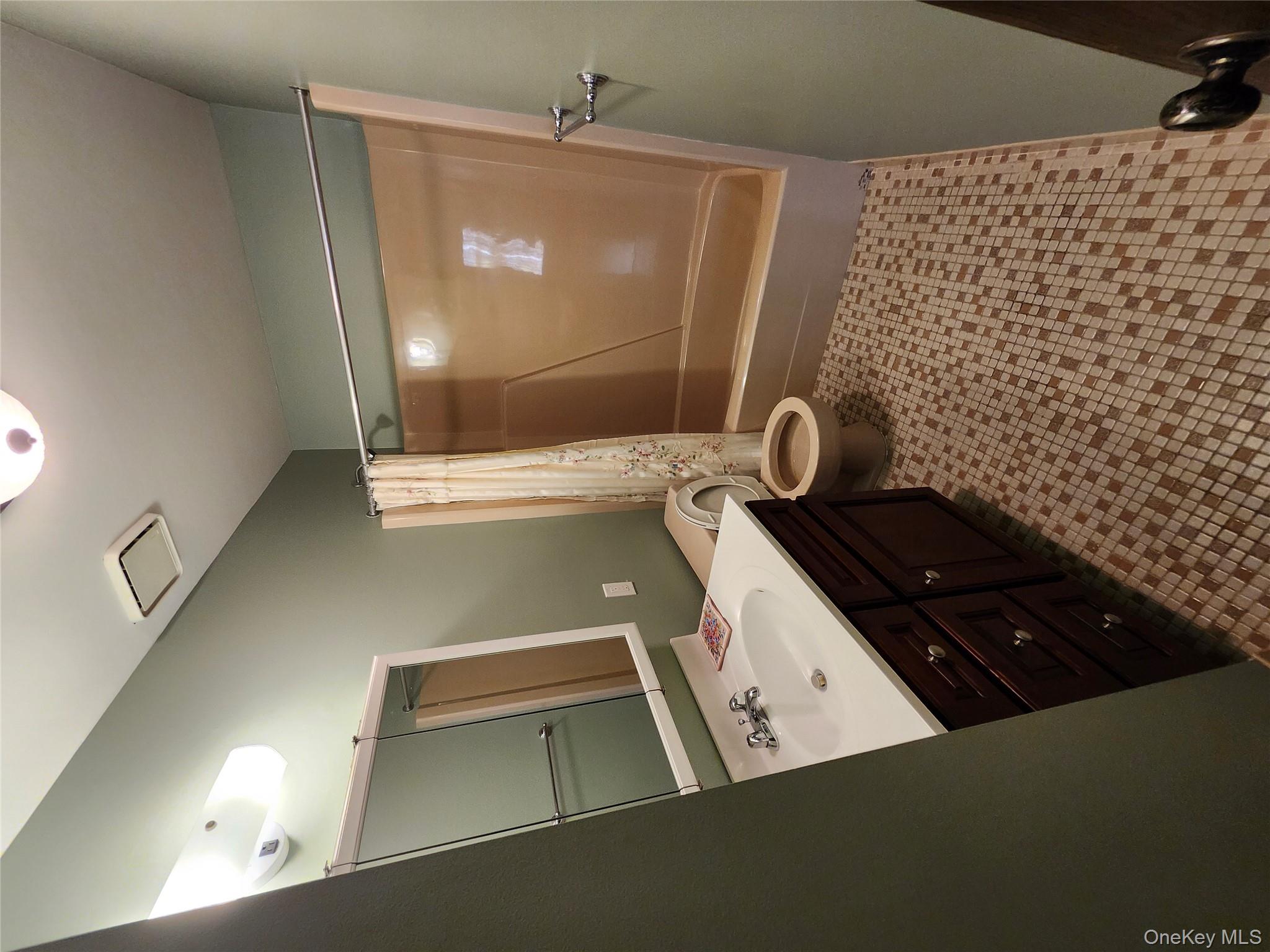 108 Village Road, Unit B Yorktown Heights, NY 10598 - Photo 36 of 42 Full bath featuring vanity, shower / bath combo with shower curtain, and light tile patterned floors