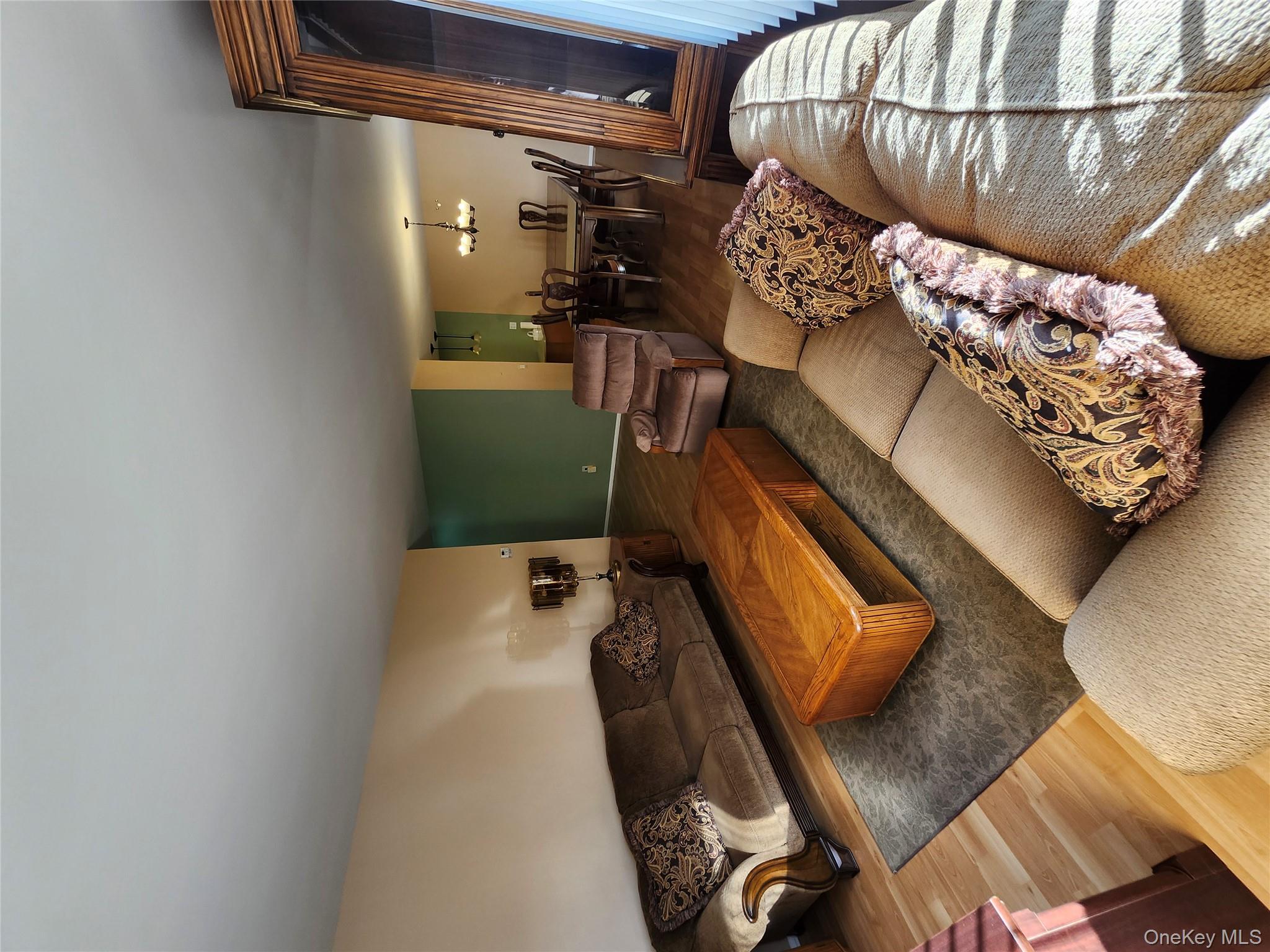 108 Village Road, Unit B Yorktown Heights, NY 10598 - Photo 39 of 42 a living room with furniture rug and lamp