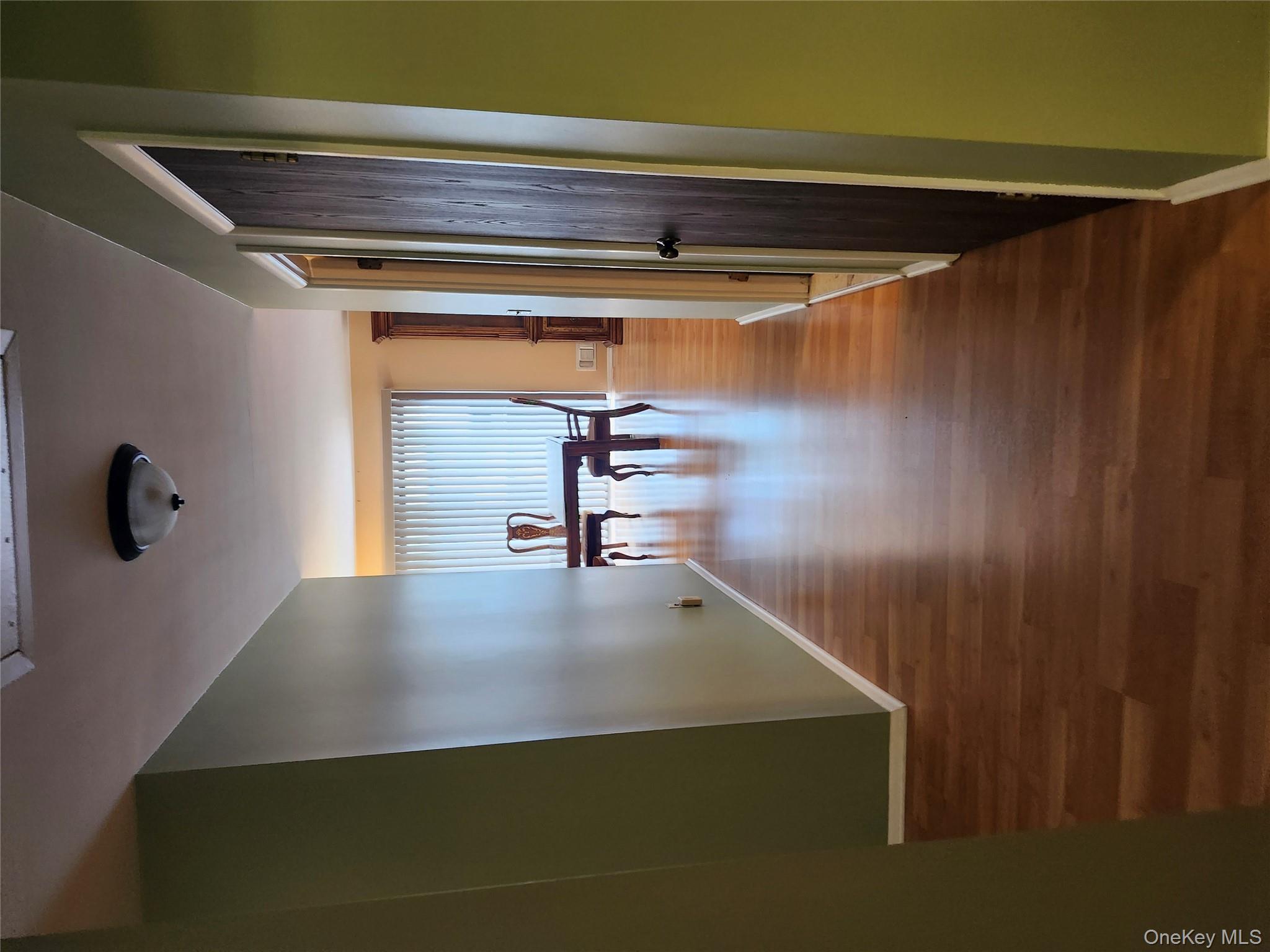 108 Village Road, Unit B Yorktown Heights, NY 10598 - Photo 4 of 42 a view of dining room with wooden floor and stairs