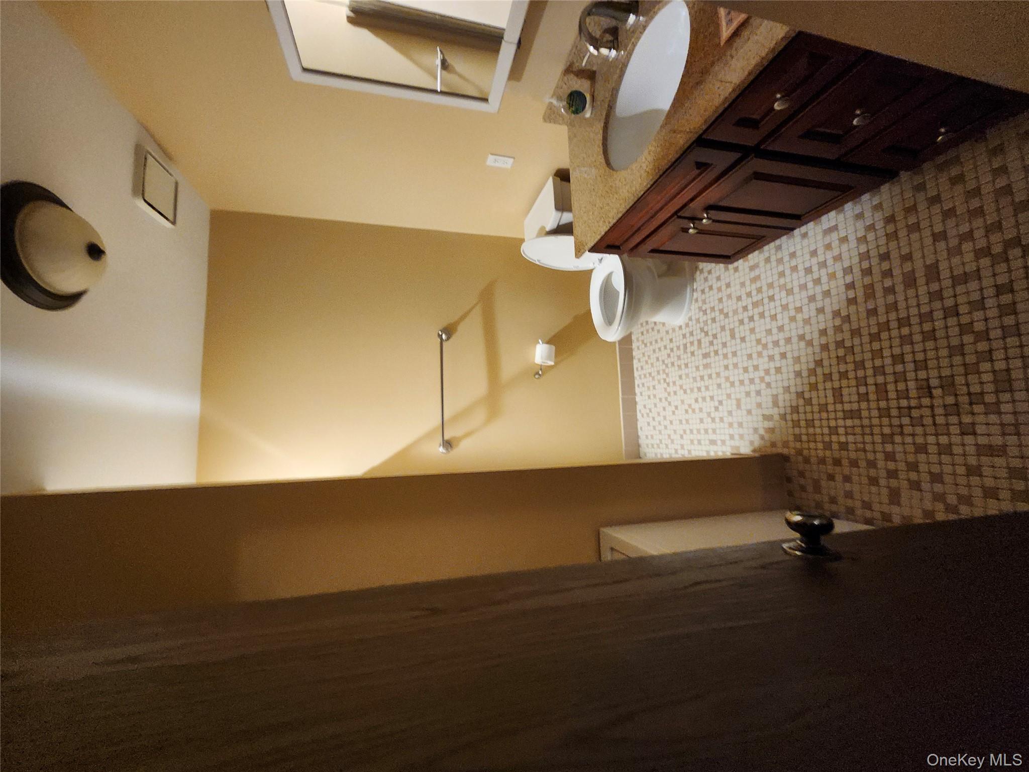 108 Village Road, Unit B Yorktown Heights, NY 10598 - Photo 42 of 42 a bathroom with a granite countertop sink toilet and shower