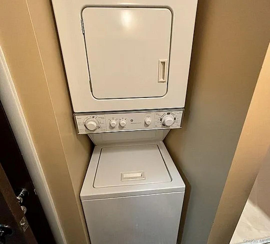 108 Village Road, Unit B Yorktown Heights, NY 10598 - Photo 7 of 42 Laundry area with stacked washer / drying machine