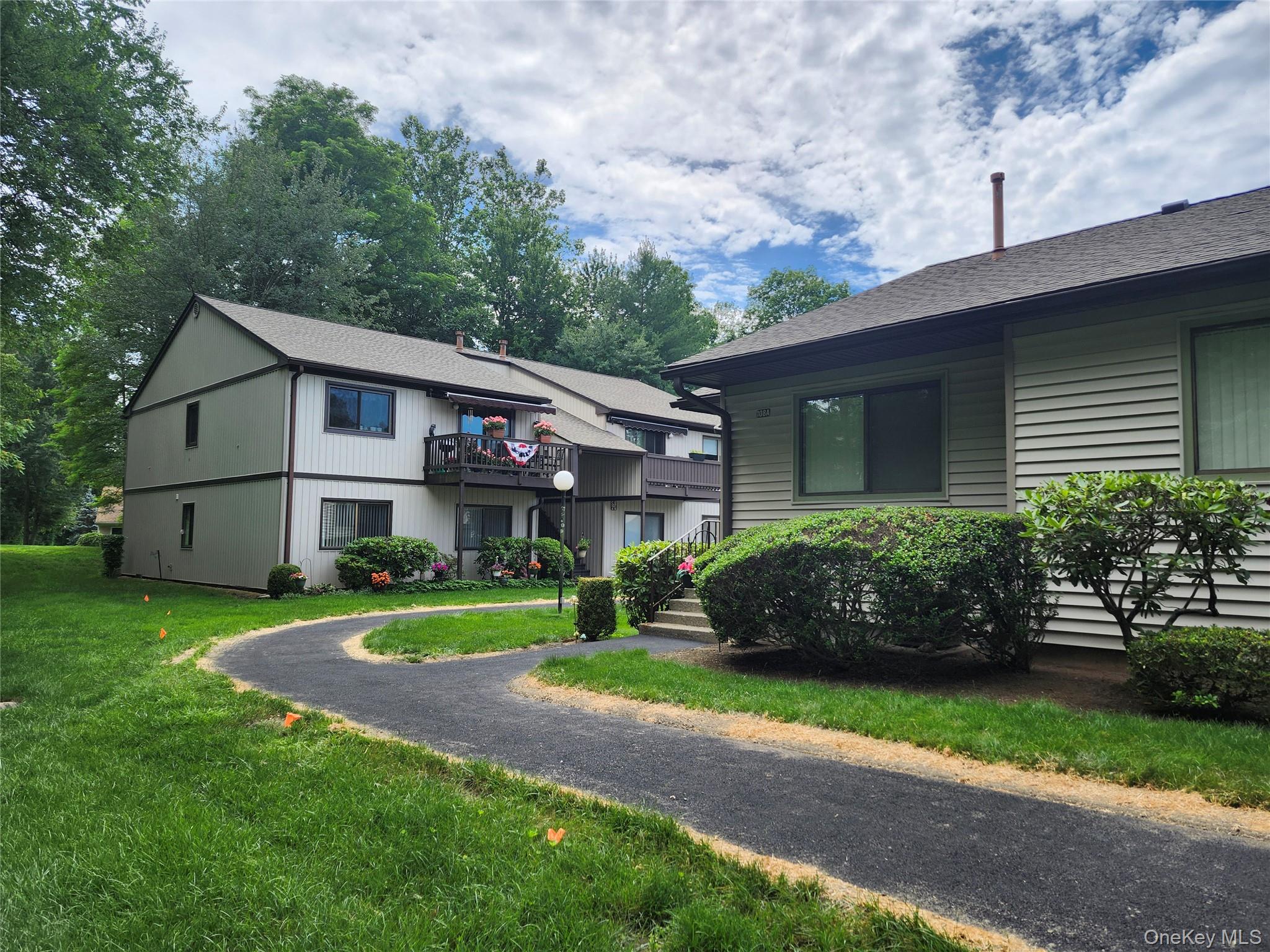 108 Village Road, Unit B Yorktown Heights, NY 10598 - Photo 10 of 42 Townhome / multi-family property featuring a front lawn and a balcony