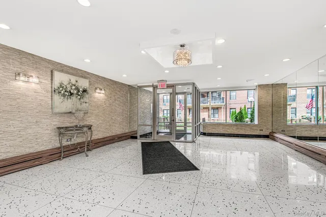 a lobby with furniture and window