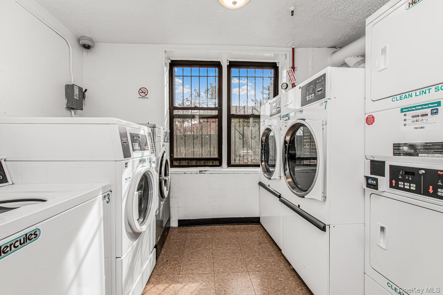 1110 Stadium Avenue, Unit 5F Bronx, NY 10465 - Photo 18 of 20 a utility room with dryer and washer