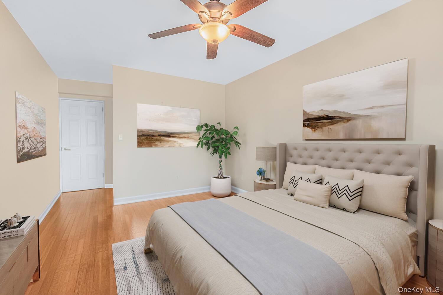 1110 Stadium Avenue, Unit 5F Bronx, NY 10465 - Photo 5 of 20 a bedroom with a bed and a chandelier