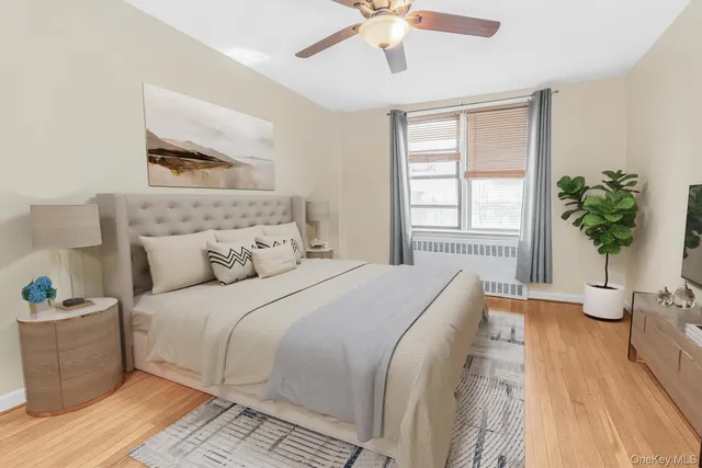 a bedroom with a large bed and a window