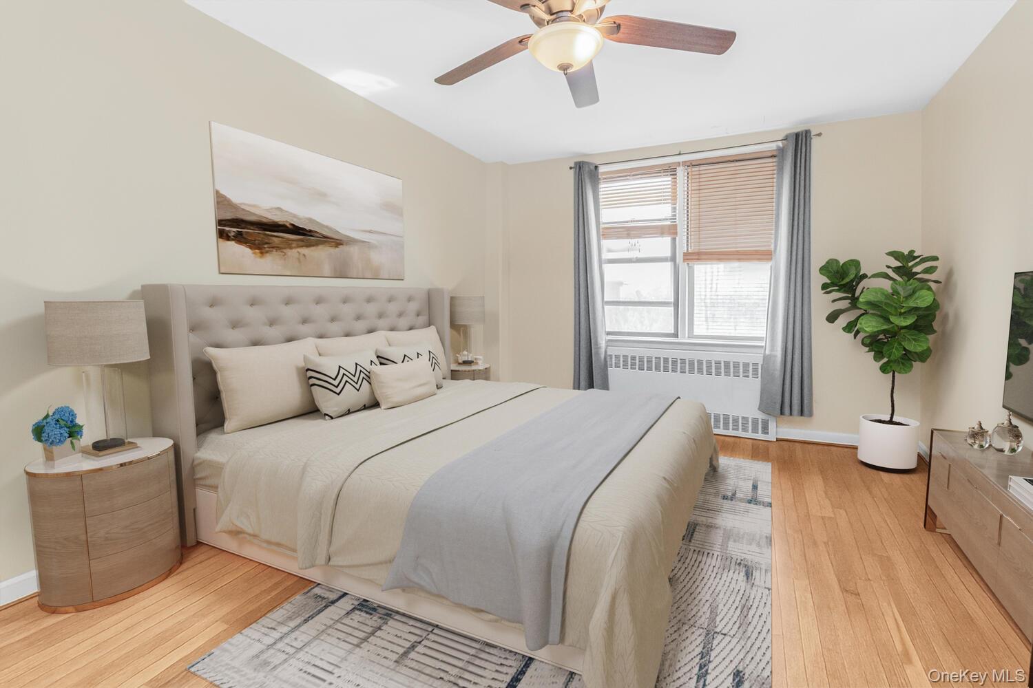 1110 Stadium Avenue, Unit 5F Bronx, NY 10465 - Photo 6 of 20 a bedroom with a large bed and a window