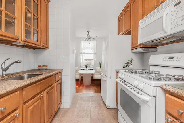 a kitchen with stainless steel appliances granite countertop a stove and a sink