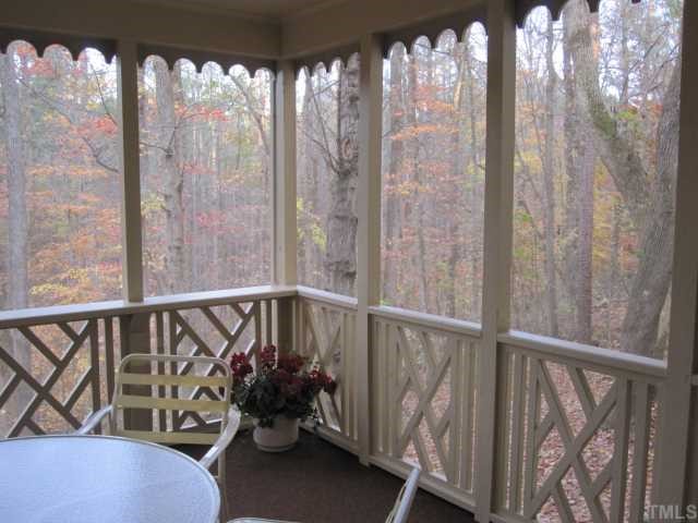 5616 North Hawthorne Way Raleigh, NC 27613 - Photo 9 of 12 Enjoy many seasonal views from the screened porch which opens to the deck and family room.