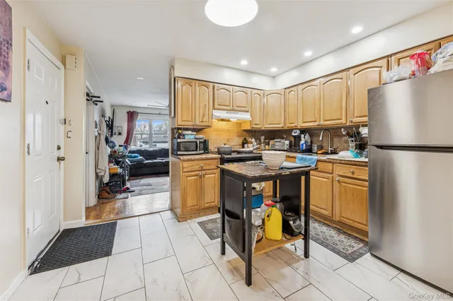 a view of a dining room with furniture and a rug