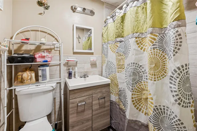 a kitchen with stainless steel appliances kitchen island granite countertop a refrigerator and a stove top oven