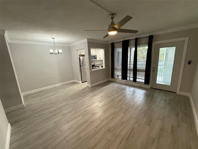 a kitchen with stainless steel appliances a refrigerator microwave and sink