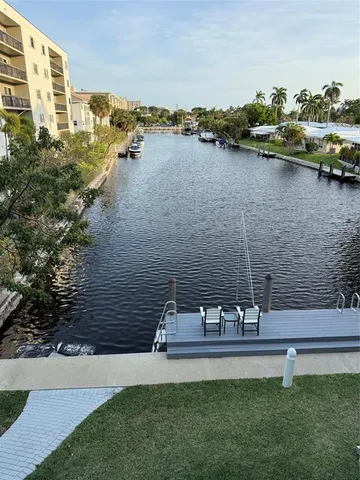 a view of a lake with a house and outdoor space