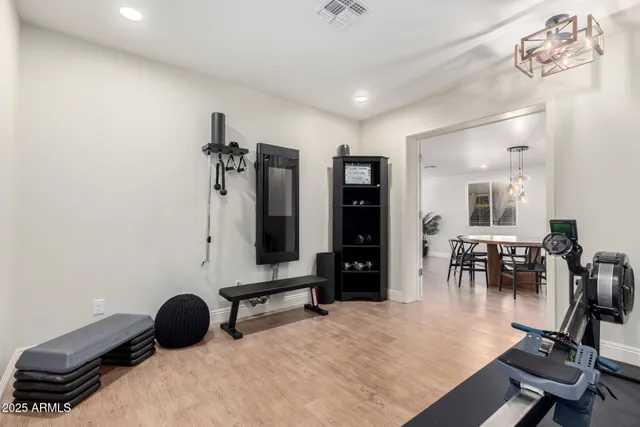 a bedroom with furniture and a chair